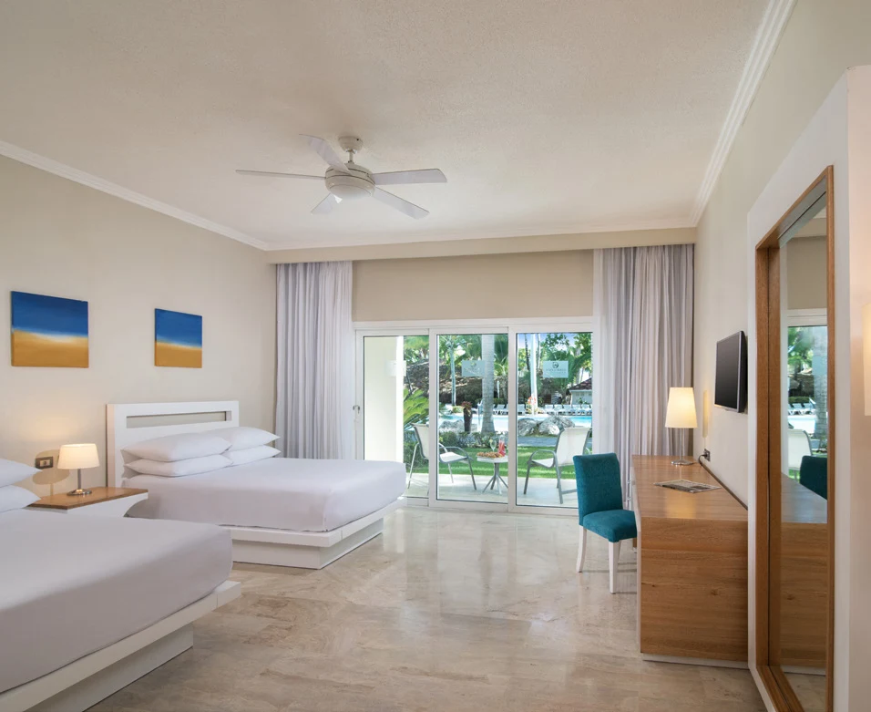 Double beds in bright hotel room