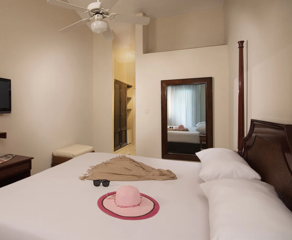 Bedroom with hat on bed