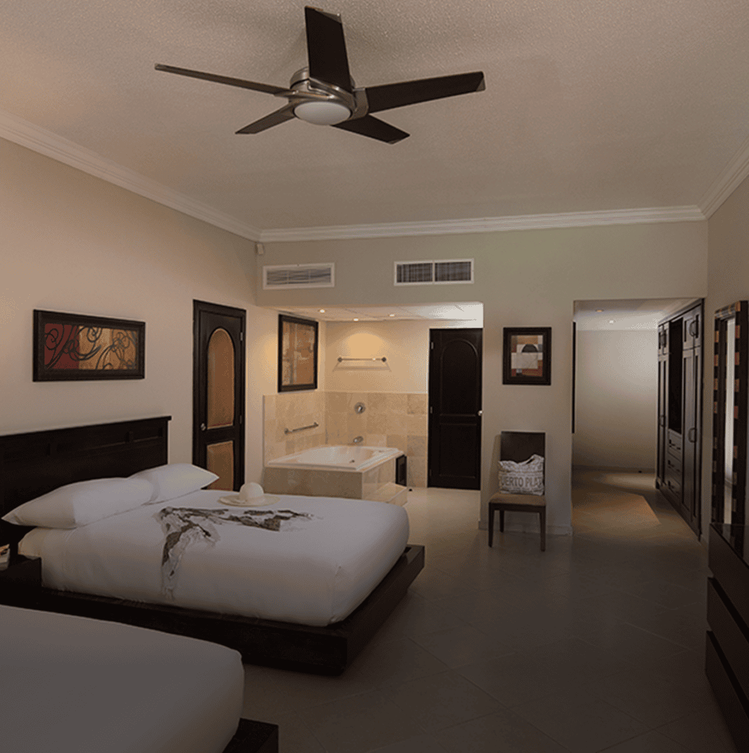 Hotel room with two beds and bathtub